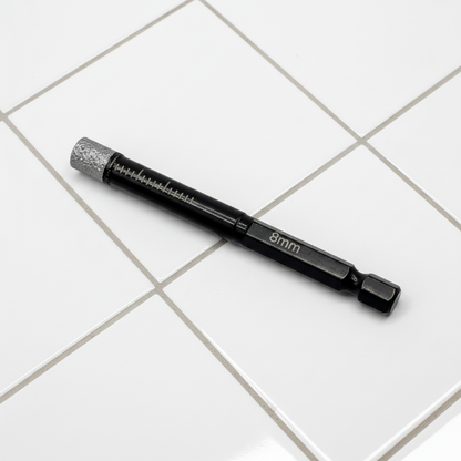 DIY Simple 8mm diamond-tipped tile drill bit with wax core, shown against tiled grout lines for cutting ceramic or stone tiles.