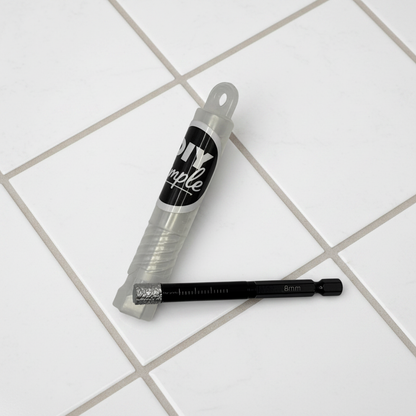 DIY Simple 8mm diamond-tipped tile drill bit with wax core, shown in packaging on a tiled surface for precise drilling.